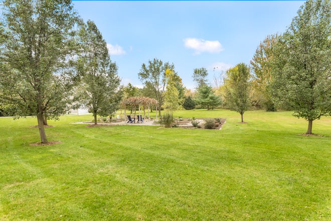 This 7,000-square-foot country estate in Salem Township, priced at $1,485,000, sits on 11 acres of land with a fishing pond, vegetable garden, hundreds of mature trees, a pole barn and more. Built in 1997, this southern colonial-style house has four bedrooms, with the possibility for up to six; four full baths and two half baths. The kitchen, nook and butler's pantry have all be recently updated. There are several fireplaces, both wood and natural; a deep finished basement, oak plank floors, and a bonus room over the garage and on the third floor. A paved road offers easy access to nearby cities, including Ann Arbor, Northville, Brighton and Plymouth.