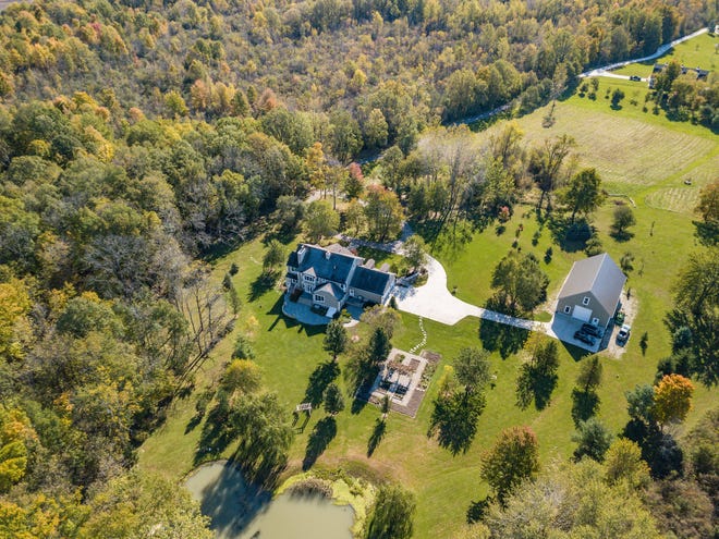 This 7,000-square-foot country estate in Salem Township, priced at $1,485,000, sits on 11 acres of land with a fishing pond, vegetable garden, hundreds of mature trees, a pole barn and more. Built in 1997, this southern colonial-style house has four bedrooms, with the possibility for up to six; four full baths and two half baths. The kitchen, nook and butler's pantry have all be recently updated. There are several fireplaces, both wood and natural; a deep finished basement, oak plank floors, and a bonus room over the garage and on the third floor. A paved road offers easy access to nearby cities, including Ann Arbor, Northville, Brighton and Plymouth.