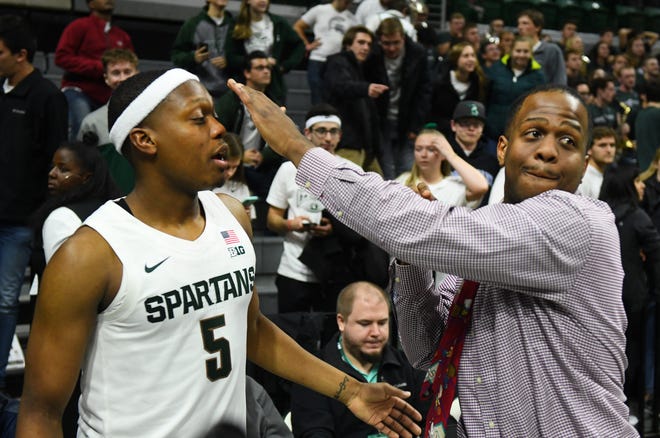 Zachary Winston, right, jokingly tries to steal the headband from his brother, Michigan State point guard Cassius Winston, during an exhibition game this month at the Breslin Center in East Lansing.