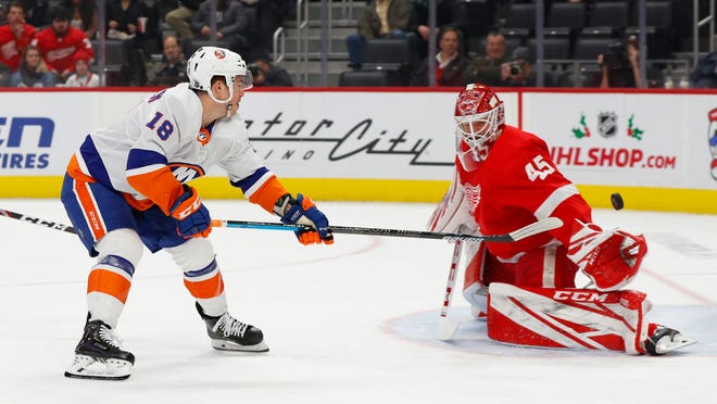 New York Islanders left wing Anthony Beauvillier (18) scores against Detroit Red Wings goaltender Jonathan Bernier (45) in the first period.