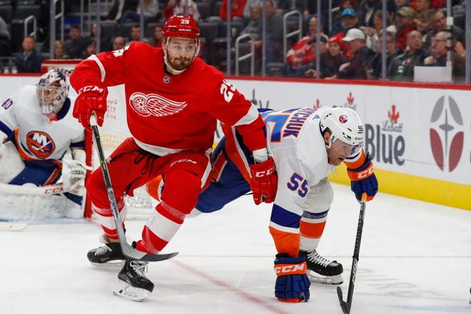 Detroit Red Wings left wing Brendan Perlini (29) and New York Islanders defenseman Johnny Boychuk (55) battle for position in the second period.