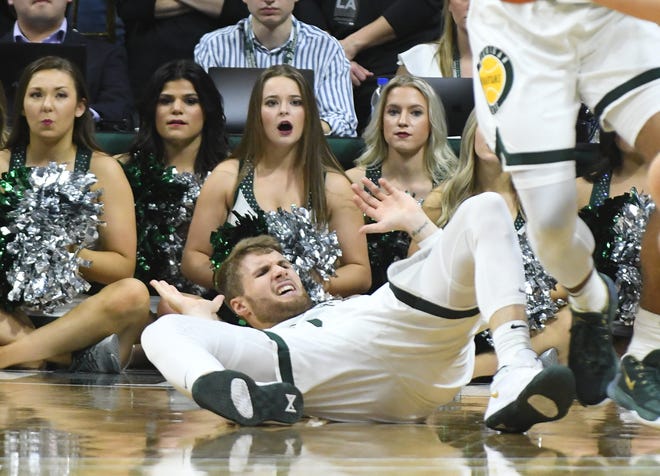 Michigan State guard Kyle Ahrens gets knocked to the floor in the second half.