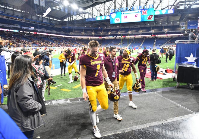 Central Michigan University's football team leaves the field after losing to Miami, 26-21, in the 2019 MAC Championship at Ford Field.