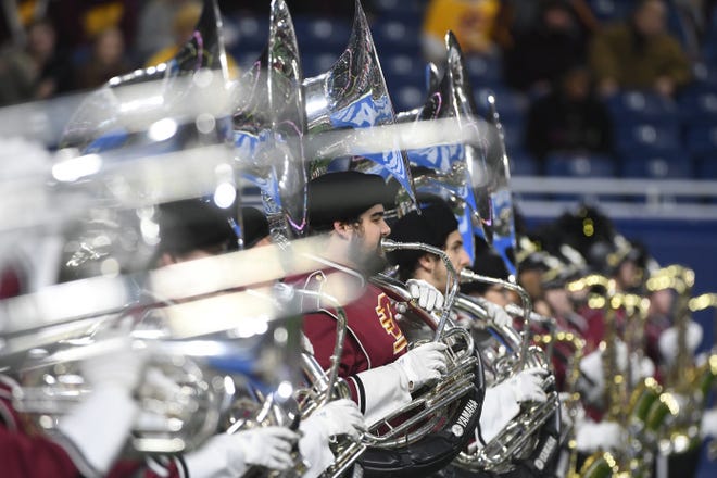 The Central Michigan University band takes the field for a pregame performance.