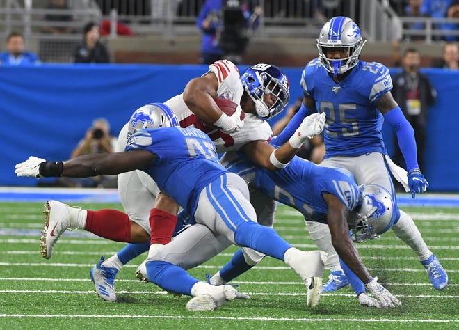 Jarrad Davis, linebacker: Whether he was hindered by a preseason ankle sprain is up for debate, but Davis (left) wasn’t able to build upon his strong finish to the 2018 season, continuing to be below-average in both run support and coverage. His only above-average contribution continued to be his blitzing, and the Lions only sent him after the quarterback an average of five times over the final six games he was healthy. Grade: D+
