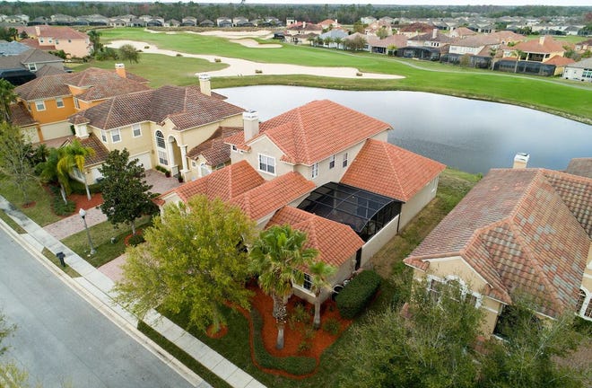 The five-bedroom, five-bath home near Orlando overlooks a pond and the third hole of the Providence Golf Club
