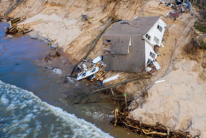 Lake Michigan erosion claims Patricia "Tish" Gancer's beach house, pictured on Thursday, Jan. 2, 2020, in White River Township, near Montague, Mich.