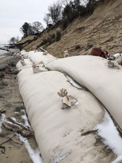 Enormous sand bags, intended to protect the bluff from erosion due to high water levels, have been placed along the shoreline of Lake Michigan to protect houses close to the water in Holland, Mich.  Erosion has already washed away the staircases leading down to the water from most of the homes