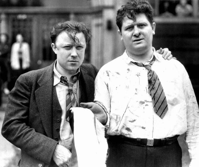 Bloodied labor heroes Walter Reuther and Richard Frankensteen show the damage after the "Battle of the Overpass" on May 26, 1937. Their historic efforts led to the first union contract with Ford Motor Co.