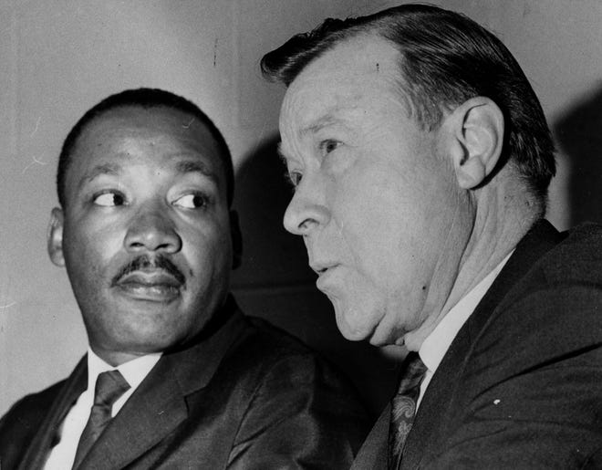 Dr. King and Walter Reuther talk on June 19, 1966, at the "We Rally For Freedom" event at Cobo Hall.