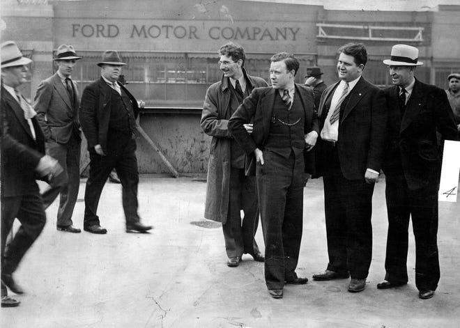 Just before the beat-down that would come to be known as the "Battle of the Overpass," three Ford security men approach union leaders Walter P. Reuther and Richard T. Frankensteen just outside the Rouge Plant on May 26, 1937. Reuther had obtained a permit from the city of Dearborn to distribute literature.