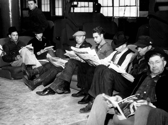 The UAW formed in 1935. Its first big attempt to unionize plants was a strike at GM's Fisher Body Plant No. 1 in Flint, beginning in December 1936. Above, strikers peruse newspapers and magazines in the 'Reading Quarters' during the strike. In February 1937, GM recognized the UAW as the exclusive bargaining representative for its employees.