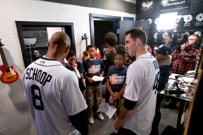 Detroit Tigers second baseman Jonathan Schoop, left, and pitcher Matthew Boyd chat with students at the Notes for Notes music program during the a stop of the Detroit Tigers winter caravan.