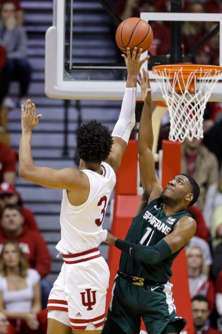 Indiana forward Justin Smith (3) shoots over Michigan State forward Aaron Henry (11) in the second half.
