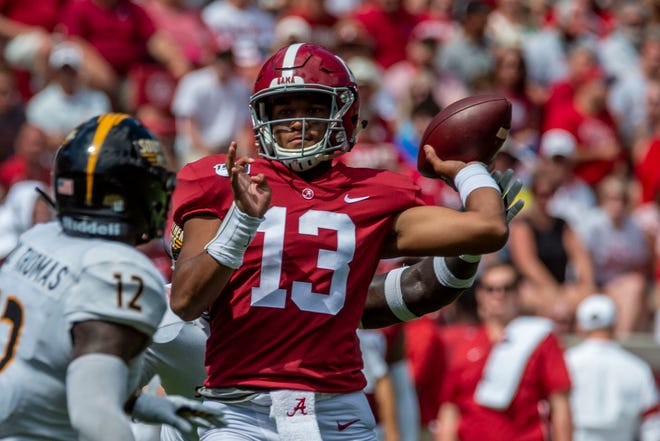 Go through the gallery to view Justin Rogers' first NFL mock draft for 2020, which includes former Alabama quarterback Tua Tagovailoa (13).