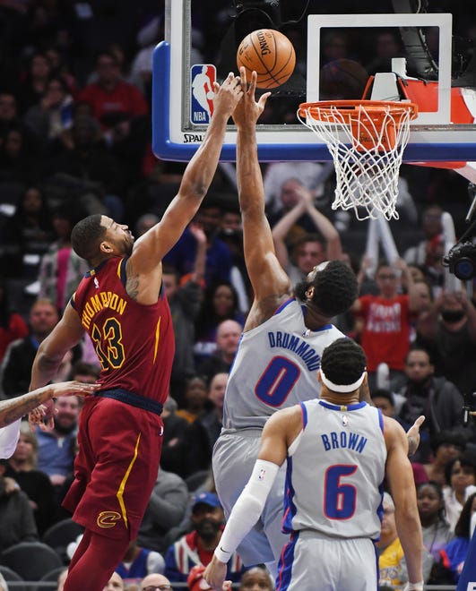 Cavaliers' Tristan Thompson puts up a shot and a bucket over Pistons' Andre Drummond in the second quarter.