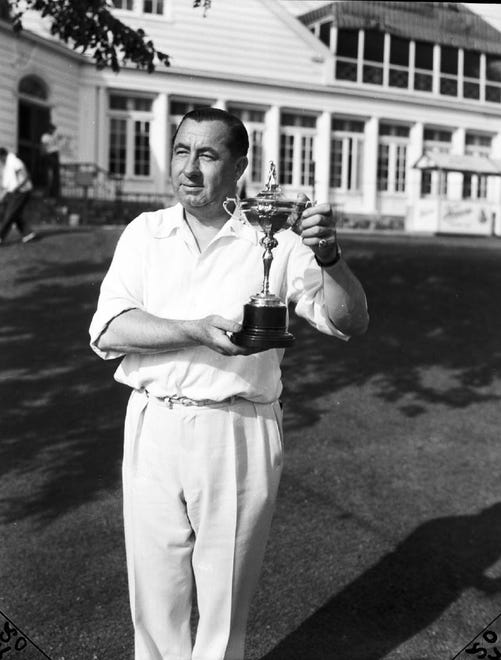 The Ryder Cup was suspended from 1939-45, but challenge matches were held to raise funds for war-related efforts. Walter Hagen, who captained the 1939, '40 and '41 teams, holds the cup after a U.S. victory at the Oakland Hills Country Club in Bloomfield Hills in 1940.