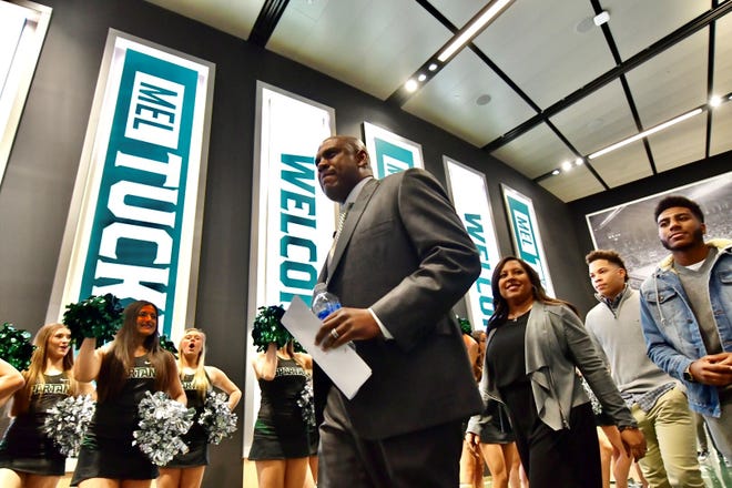 Mel Tucker arrives for his press conference at the Breslin Center on Wednesday night.