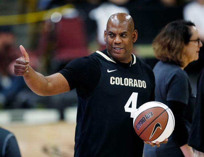 Colorado head football coach Mel Tucker gestures to fans prior to a game against Colorado State.