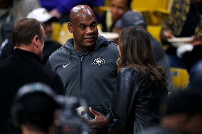 Colorado head football coach Mel Tucker speaks with fans during a school basketball game earlier this year.