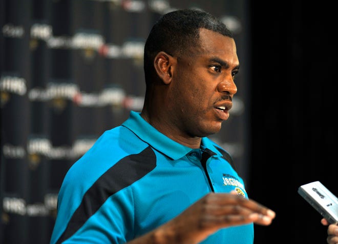 Mel Tucker answers a question during a news conference Tuesday, Nov. 29, 2011,  after he was named Jacksonville Jaguars interim coach when Jack Del Rio was fired by team owner Wayne Weaver.