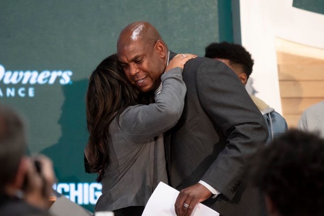 Mel Tucker gets a hug from his wife JoEllyn after being introduced as the next head football coach for Michigan State University.
