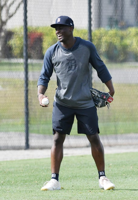 Tigers outfielder Daz Cameron laughs while working on throws from the outfield during a voluntary workout.