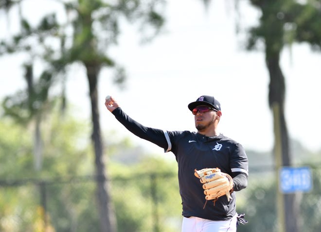 Tigers infielder Isaac Paredes makes a throw during infield practice.