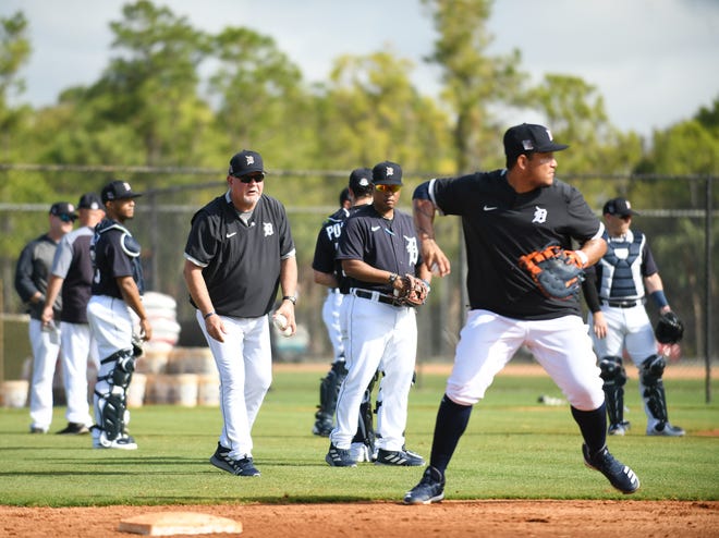 Tigers manager Ron Gardenhire, left, watches first baseman Miguel Cabrera, right, about to throw during the 'Good Morning America' drill.  The drill is a high-energy, wake-up drill that involves every position.