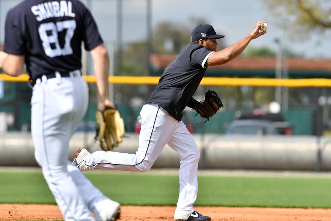Tigers third baseman Jeimer Candelario practices a run down.