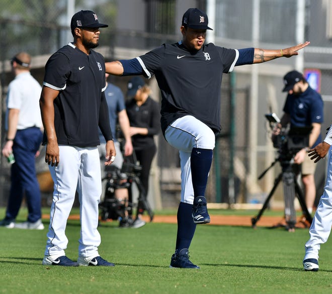 From left, Tigers' Jeimer Candelario with a balancing Miguel Cabrera during warmups.