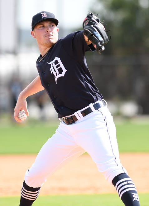 Tigers pitcher Beau Burrows throws live batting practice.