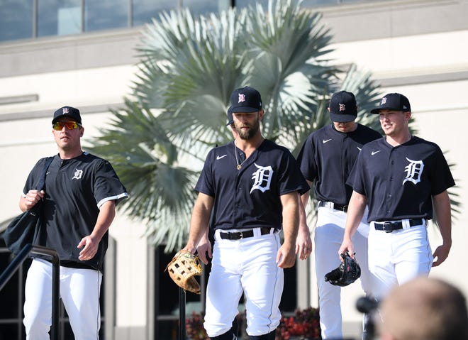 From left, Tigers pitchers Jordan Zimmermann, Daniel Norris and Beau Burrows head to the fields.