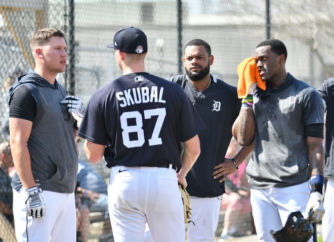 From left, Tigers' JaCoby Jones, non-roster invitee Jorge Bonifacio and Cameron Maybin talk with pitcher Tarik Skubal after live batting practice.