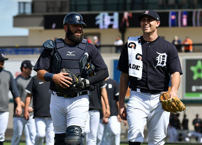 Tigers catcher Austin Romine and starting pitcher Matthew Boyd walk to the dugout before the game.