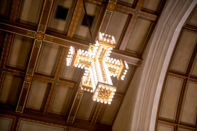 A cross made from 408 light bulbs floats high above the chapel which sits in the center of the Masonic Temple, in Detroit,, February 23, 2020.