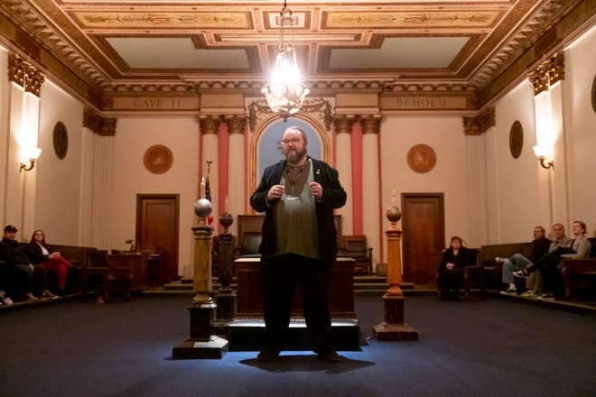 A tour group listens to docent Simon McNeilly talk about the Corinthian lodge room during a tour of the Masonic Temple, in Detroit, given by the temple's library archive, and research center, February 23, 2020.