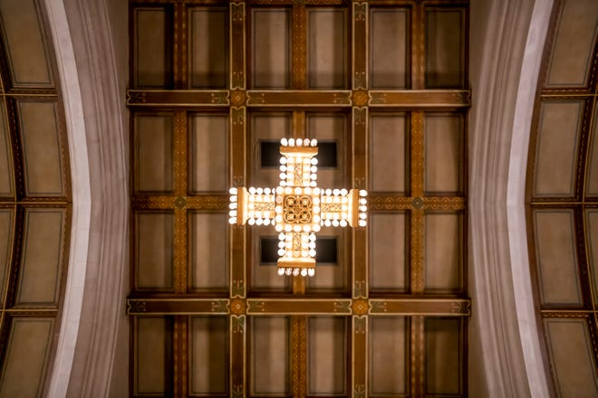 A cross made from 408 light bulbs floats high above the chapel which sits in the center of the Masonic Temple, in Detroit,, February 23, 2020.