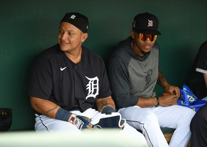 From left, Tigers' Miguel Cabrera with outfielder Jose Azocar in the dugout.