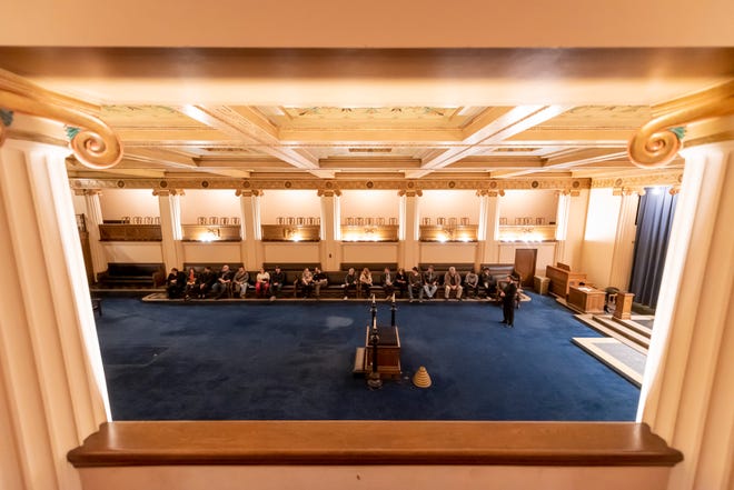 Members of a tour group sit and listen about the Greek Ionic lodge room during a tour of the Masonic Temple, in Detroit, February 23, 2020.