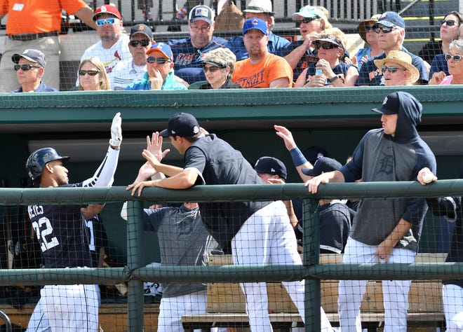 Tigers' Victor Reyes is congratulated after his RBI sacrifice fly in the third inning, the only run scored by the Tigers.