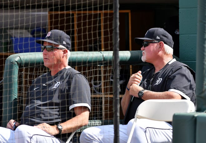 From let, Tigers pitching coach Rick Anderson and manager Ron Gardenhire sit outside the dugout mid fourth inning.