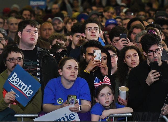 Bernie supporters listen from the front row during Democratic Presidential candidate Bernie Sanders rally.