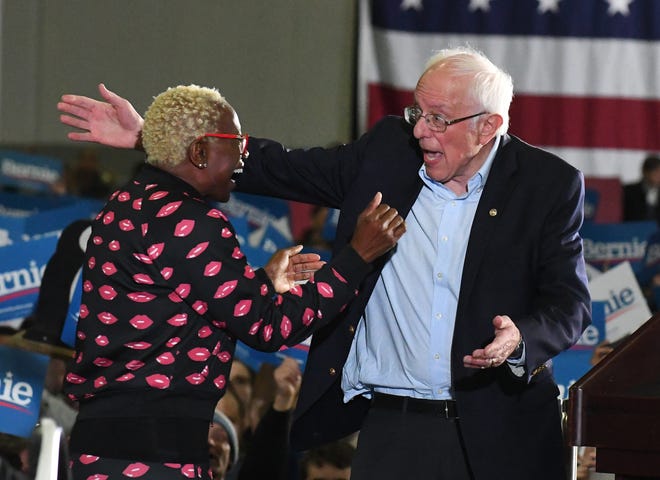 Former Ohio State Senator Nina Turner gets a hug from Bernie Sanders at his rally in Detroit.