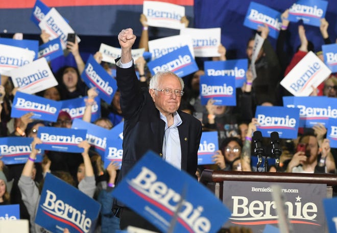 Presidential candidate Bernie Sanders acknowledges the cheers of the crowd as he takes the stage to give a campaign speech at TCF Center in Detroit, Michigan on March 6, 2020.