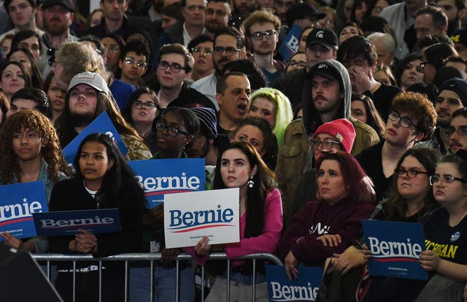 Bernie supporters listen from the front row during Democratic Presidential candidate Bernie Sanders rally in Detroit.