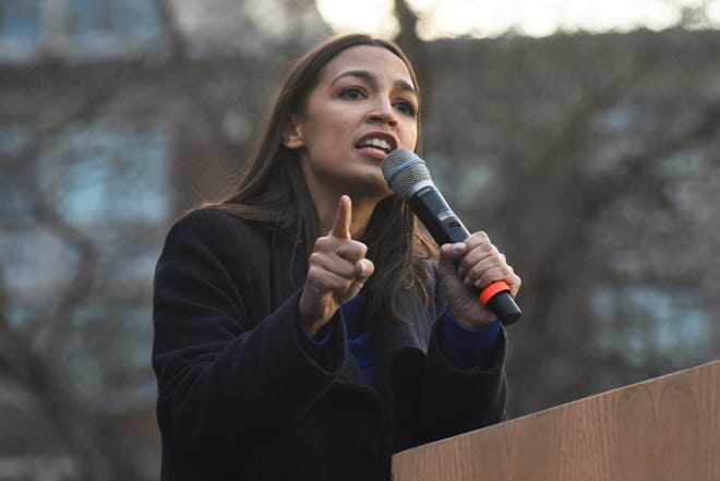 U.S. Representative Alexandria Ocasio-Cortez addresses the crowd before U.S. Senator and presidential candidate Bernie Sanders came on stage on the campus of The University of Michigan, Sunday, March 8, 2020 in Ann Arbor, Mich.