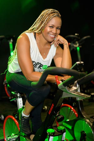 Latricia Wilder, owner of Vibe Ride, a boutique gym in downtown Detroit, isn't bringing in any money during the coronavirus public health crisis that has shut down all gyms across the state.