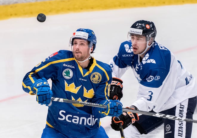 Sweden's Mathias Brome, left, battles Finland's Ville Pokka at Hovet Arena in Stockholm last year.