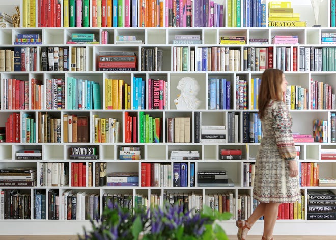 Custom shelving showcase books throughout a Greenwich Village townhouse.  “We feel that books are their own form of art and they add character, personality, and soul to any space,” the pair explains.